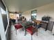 Covered patio featuring an outdoor dining set and plenty of space for entertaining at 1619 Prairie Blossom Dr, Lakeland, FL 33810
