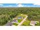 Aerial view of a cozy home nestled within a lush, green landscape at 1896 12Th St, Orange City, FL 32763