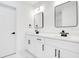 Bathroom with double vanity, modern mirrors, and black hardware at 1896 12Th St, Orange City, FL 32763