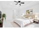 A spacious bedroom boasts modern lighting and a large bed with gold accents at 1896 12Th St, Orange City, FL 32763