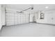 Spacious garage with modern door, utility connections, and ample room at 1896 12Th St, Orange City, FL 32763