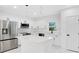 Modern kitchen featuring white cabinetry, stainless steel appliances, and a center island at 1896 12Th St, Orange City, FL 32763