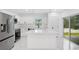 Bright kitchen with white cabinets, stainless steel appliances, and a center island at 1896 12Th St, Orange City, FL 32763