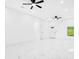 Bright living room featuring modern ceiling fans, sleek white walls, and beautiful marble flooring at 1896 12Th St, Orange City, FL 32763