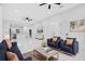 Bright living room boasts sleek marble floors, modern furnishings, and an open floorplan at 1896 12Th St, Orange City, FL 32763