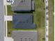 An aerial view of a well-maintained home with a dark roof and green lawn at 1029 Mattie Pointe Way, Auburndale, FL 33823