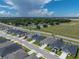 An aerial view depicts the home's location in a peaceful neighborhood, close to schools, parks, and main roads at 1029 Mattie Pointe Way, Auburndale, FL 33823