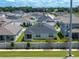 An aerial view of the home in a neighborhood showcases its location and charming curb appeal at 1029 Mattie Pointe Way, Auburndale, FL 33823