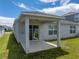 A back patio provides the perfect spot to relax and enjoy the outdoors at 1029 Mattie Pointe Way, Auburndale, FL 33823