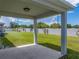 A back patio overlooks the fenced yard and offers a shaded area at 1029 Mattie Pointe Way, Auburndale, FL 33823