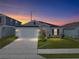 Charming single-story home with well-manicured lawn, two car garage, and beautiful landscaping at 1029 Mattie Pointe Way, Auburndale, FL 33823