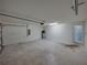 The garage has concrete flooring, an automatic door, and a water heater at 1029 Mattie Pointe Way, Auburndale, FL 33823
