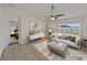 Bright living room features modern decor, tile flooring, and views to the outside at 1029 Mattie Pointe Way, Auburndale, FL 33823