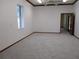 Bright bedroom offering plush carpet and ample natural lighting at 2410 Nevada Rd, Lakeland, FL 33803