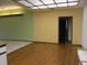 Spacious living room featuring hardwood floors and textured wallpaper accents at 2410 Nevada Rd, Lakeland, FL 33803