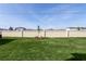 Large backyard with green lawn, surrounded by a vinyl fence at 2429 Leeds St, Haines City, FL 33844