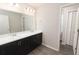 Bathroom featuring double vanity with modern fixtures and spacious layout at 2429 Leeds St, Haines City, FL 33844