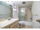 Standard bathroom features a shower-tub combo with glass doors and a single sink vanity at 480 Nighthawk Dr, Lakeland, FL 33813