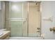 Clean bathroom with white tiled shower and frosted sliding glass door at 480 Nighthawk Dr, Lakeland, FL 33813