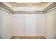 Empty closet with beige carpeting, white walls and shelving at 480 Nighthawk Dr, Lakeland, FL 33813