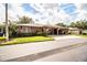 Exterior view of brick home with well-maintained landscaping and driveway at 480 Nighthawk Dr, Lakeland, FL 33813