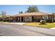 Charming single-story brick home with a covered carport, patriotic decorations, and well-maintained landscaping at 480 Nighthawk Dr, Lakeland, FL 33813