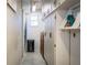 Hallway with storage cabinets and a window, providing ample storage space at 480 Nighthawk Dr, Lakeland, FL 33813