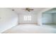 Bright and spacious living room with neutral carpet, white walls, and ample natural light at 480 Nighthawk Dr, Lakeland, FL 33813