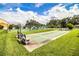 Community shuffleboard courts and tennis courts with benches at 480 Nighthawk Dr, Lakeland, FL 33813
