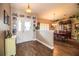 Bright entryway with wood-look tile floors, leading to formal dining room at 5811 Trophy Loop, Lakeland, FL 33811