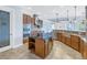 Kitchen with modern appliances, kitchen island, stainless steel sink and lots of cabinet space at 6414 Highlands In The Woods St, Lakeland, FL 33813