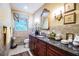 Elegant bathroom with granite countertop and a large mirror at 7525 Catherine Dr, Lakeland, FL 33810