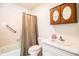 Clean bathroom with a shower/tub combo and updated vanity at 7525 Catherine Dr, Lakeland, FL 33810