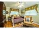 Bedroom with a crib and a comfortable armchair at 7525 Catherine Dr, Lakeland, FL 33810