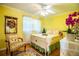 Cheerful bedroom with yellow walls and a comfortable bed at 7525 Catherine Dr, Lakeland, FL 33810
