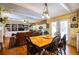 Bright dining area with wood table and chairs, adjacent to kitchen at 7525 Catherine Dr, Lakeland, FL 33810
