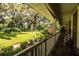 Charming home exterior with a spacious front porch, overlooking a lush green lawn at 7525 Catherine Dr, Lakeland, FL 33810
