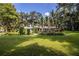Beautifully landscaped front yard with lush greenery and a charming one-story brick home at 7525 Catherine Dr, Lakeland, FL 33810