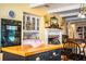 Kitchen with island, white cabinets, double oven, and fireplace at 7525 Catherine Dr, Lakeland, FL 33810