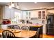 Eat-in kitchen with white cabinets, stainless steel appliances and island at 7525 Catherine Dr, Lakeland, FL 33810