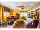 Spacious living room with two leather armchairs, built in shelving and a decorative rug at 7525 Catherine Dr, Lakeland, FL 33810