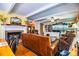 Cozy living room features a brick fireplace and built-in shelving at 7525 Catherine Dr, Lakeland, FL 33810