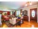 Living room with red accents and antique furniture at 7525 Catherine Dr, Lakeland, FL 33810