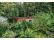 Exterior view of a shed surrounded by lush tropical vegetation at 7525 Catherine Dr, Lakeland, FL 33810