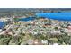 Aerial view of a lakefront home community, showcasing the property's location and surrounding landscape at 206 Clovis Pass, Winter Haven, FL 33880