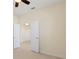Spacious bedroom with two doors and dark hardwood floors at 206 Clovis Pass, Winter Haven, FL 33880