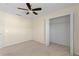Bright bedroom with ceiling fan and walk-in closet at 206 Clovis Pass, Winter Haven, FL 33880
