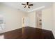 Primary bedroom with dark hardwood floors and ceiling fan at 206 Clovis Pass, Winter Haven, FL 33880