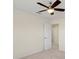 Bedroom with ceiling fan and exterior view at 206 Clovis Pass, Winter Haven, FL 33880
