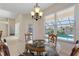 Breakfast nook with glass table and pool view at 206 Clovis Pass, Winter Haven, FL 33880